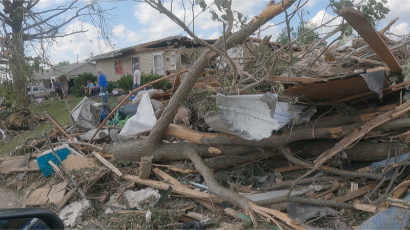 A home is surrounded by debris following Tuesday's deadly tornado in Greenfield, Iowa.