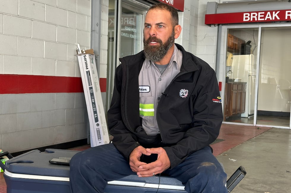 Adam Bowman, a supervisor at Grade A Auto Parts Recycling, is interviewed on Thursday, Nov....