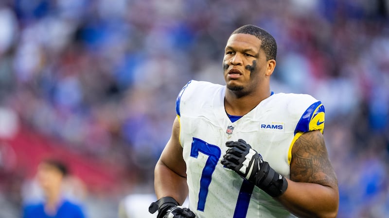 FILE - Los Angeles Rams offensive tackle Alaric Jackson (77) runs off the field at halftime...