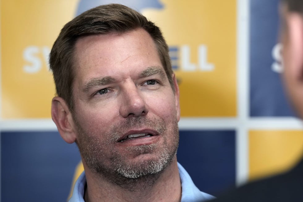 FYI - Rep. Eric Swalwell, D-Calif., talks with reporters after holding a town hall meeting in...