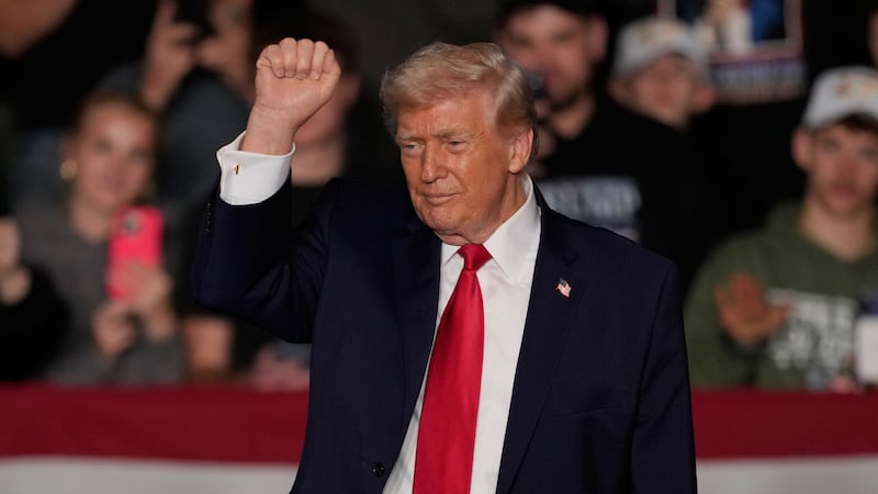President Donald Trump gestures after speaking about the economy at a rally Tuesday, Jan. 27,...