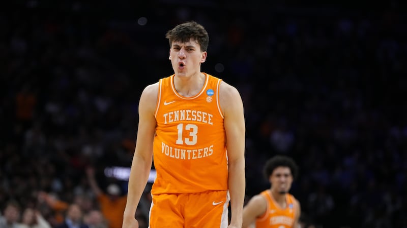Tennessee's J.P. Estrella reacts after a basket during the second half against Virginia in the...