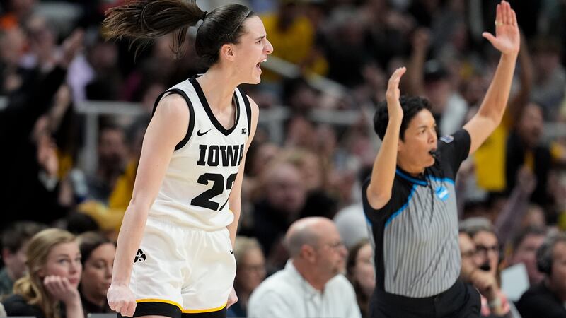 Iowa guard Caitlin Clark (22) reacts after hitting a three-point shot against LSU during the...