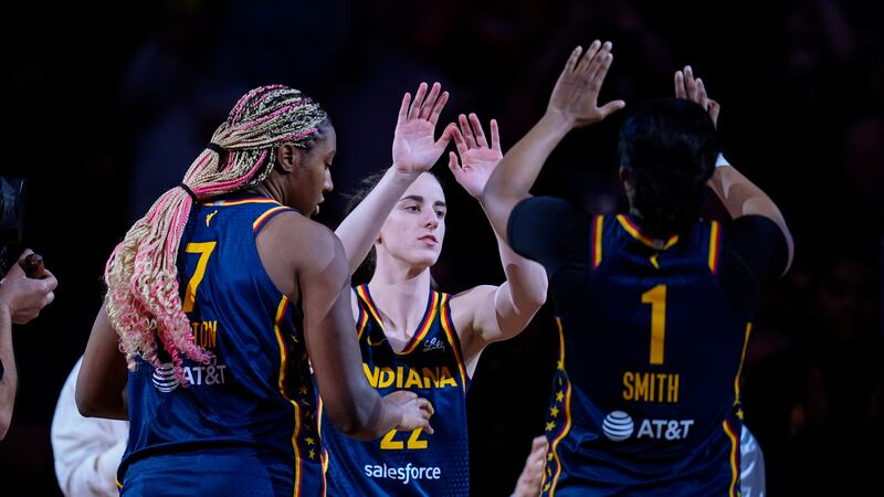 Raucous crowd roars its approval for Caitlin Clark in her home debut with Fever, an 83-80 win