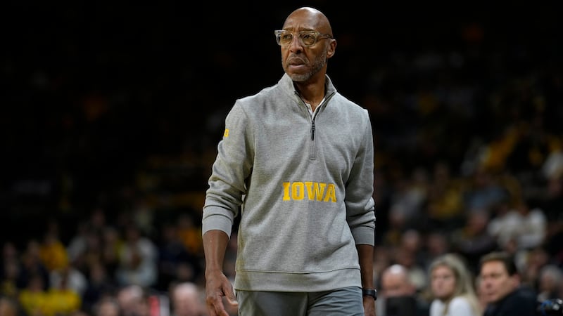 Iowa assistant coach Sherman Dillard watches from the bench during the second half of an NCAA...