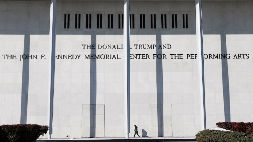 A woman walks outside The John F. Kennedy Memorial Center For The Performing Arts, Monday,...